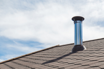 Chimney-pipe-from-stainless-steel-on-the-roof-of-the-house_xs.jpg